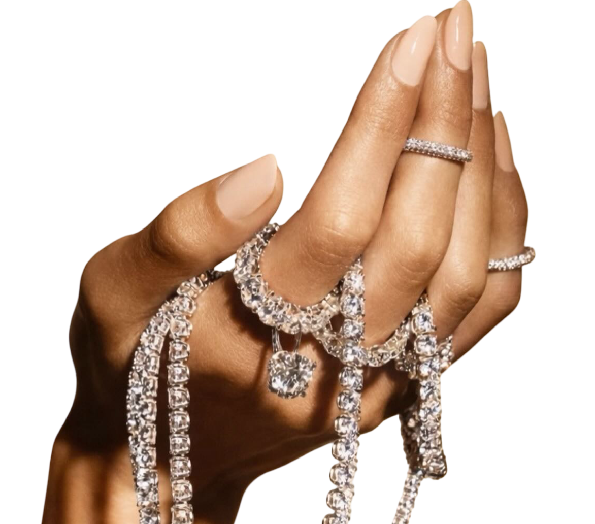 Hand holding diamond jewelry